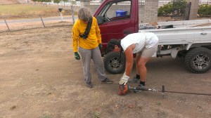 Ellen and Sherry battling with the weed eater