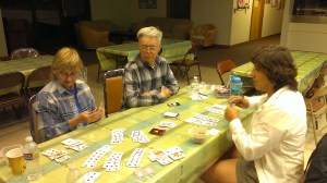 Sue, Dennis, and Sherry playing Hand and Foot Card Game